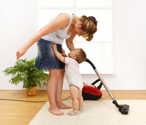 using a vacuum cleaner while house cleaning