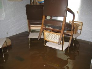 Immediately remove the submerged furniture from the water to a safe, dry area.