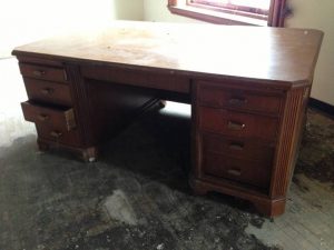 Water damaged desk that can be fixed by a professional