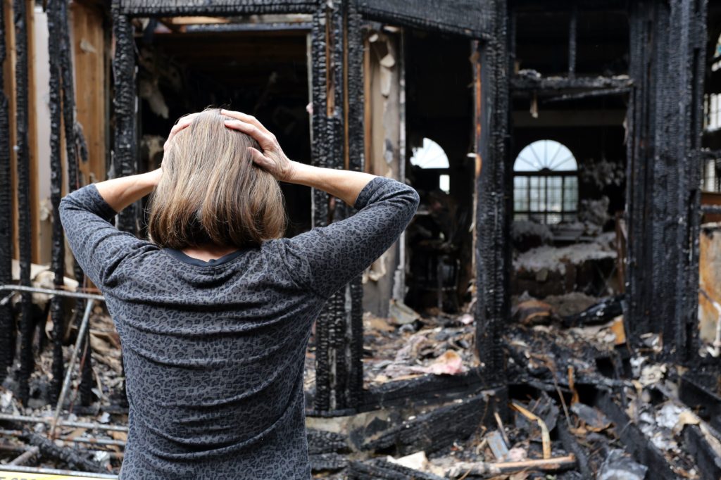 House-Fire-Damage-Woman-Stressed